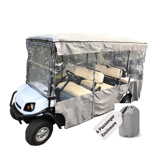 A 6-seater EZGO golf cart in white and black, equipped with the Premium Tight Weave 6 Passengers Driving Enclosure Golf Cart Cover by Formosa Covers, featuring a grey and transparent vinyl enclosure for passenger protection. In the forefront is a matching storage bag tagged "6 Passenger Enclosure," with a durable YKK zipper for easy access.