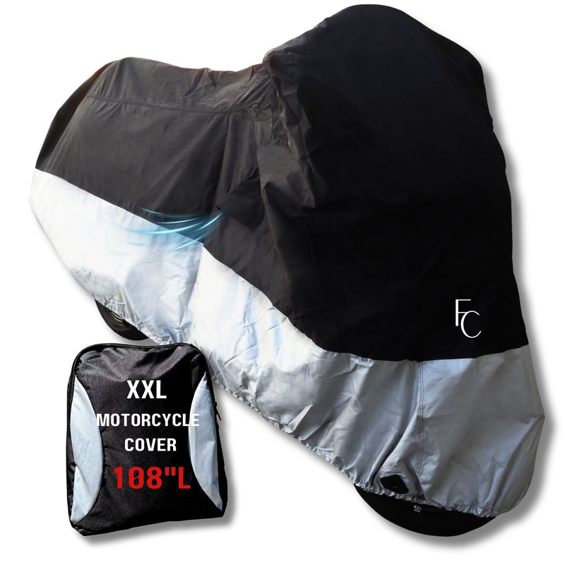 A motorcycle is covered by a water-repellent, black and silver Deluxe Motorcycle Cover by Formosa Covers. In the foreground, there is a black carrying bag labeled "XXL Motorcycle Cover 108" L" in white text. The logo "FC" is visible on the side of the heat-resistant cover designed for all seasons and lightweight protection.