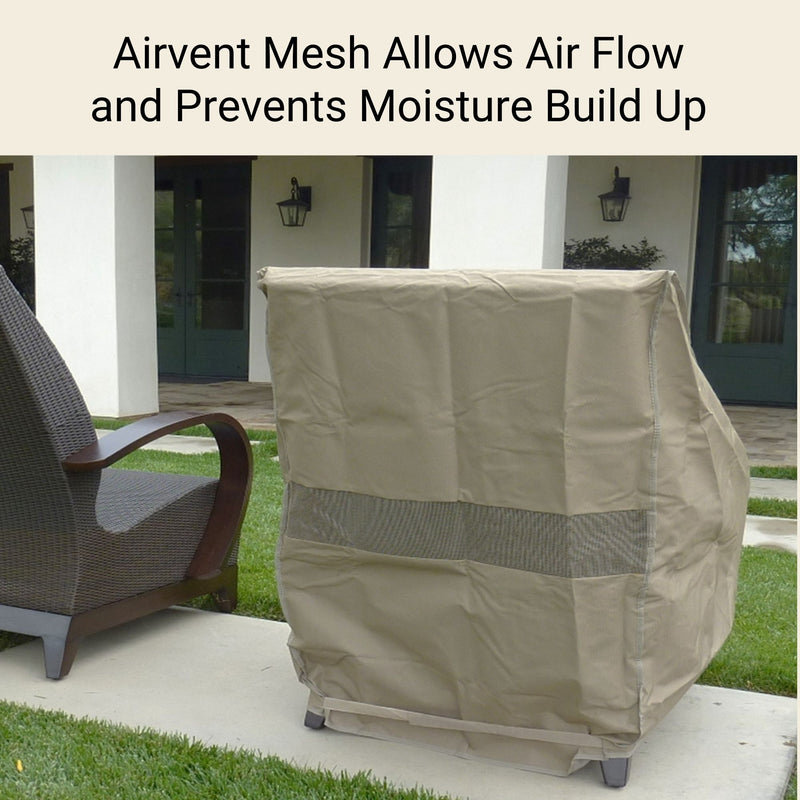 Next to a covered Formosa Covers Patio Outdoor Club Chair, another chair sits uncovered on a grassy lawn. The Classic Taupe chair cover, sized 33.5"W x 36"D x 37"H, features a mesh section for airflow. In the background, a house with white walls and a green door is visible. Text above reads, "Airvent Mesh Allows Air Flow and Prevents Moisture Build-Up.