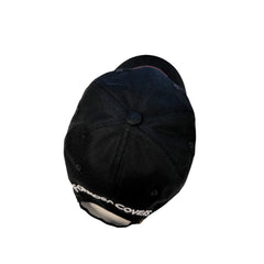 The Formosa Covers Embroidered Adjustable Dad Hat by Formosa Covers is a black cotton twill cap with white embroidered text along the back edge, partially visible in the image. The hat, shown from a slightly elevated rear perspective, features an adjustable strap and a button on top.