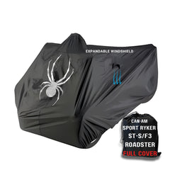 A black Can-Am Spyder RS is protected with a waterproof bike cover from Formosa Covers, which features a large white spider graphic and the words 