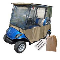 A blue Yamaha Drive golf cart is shown equipped with a beige, heavy-duty vinyl enclosure from Formosa Covers, covering the passenger area. The transparent enclosure allows visibility inside. A matching beige storage bag labeled 