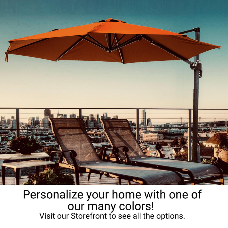 A rooftop patio with two lounge chairs under a Tuscan Orange 11ft Cantilever Supported Bar Umbrella from Formosa Covers, overlooking a city skyline. The text reads, "Personalize your home with one of our UV Treated colors! Visit our Storefront to see all the options.